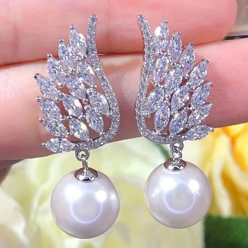 Pearl Wing Earrings with Zircon Inlay.