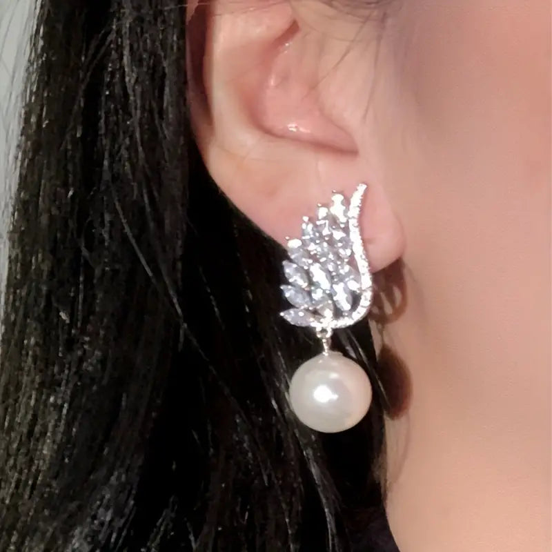 Pearl Wing Design Earrings with Zircon Inlay.